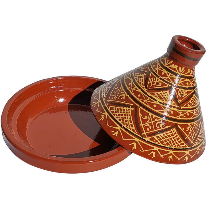 Glaseret marokkansk lertagine med mønster, traditionel kogegryde til krydderiopskrifter