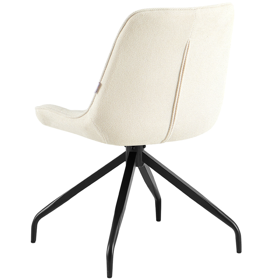 Set bagfra af den polstrede stol, som kan drejes 360° i beige med sort metalstel - elegant ryglæn med fin struktur og klare linjer